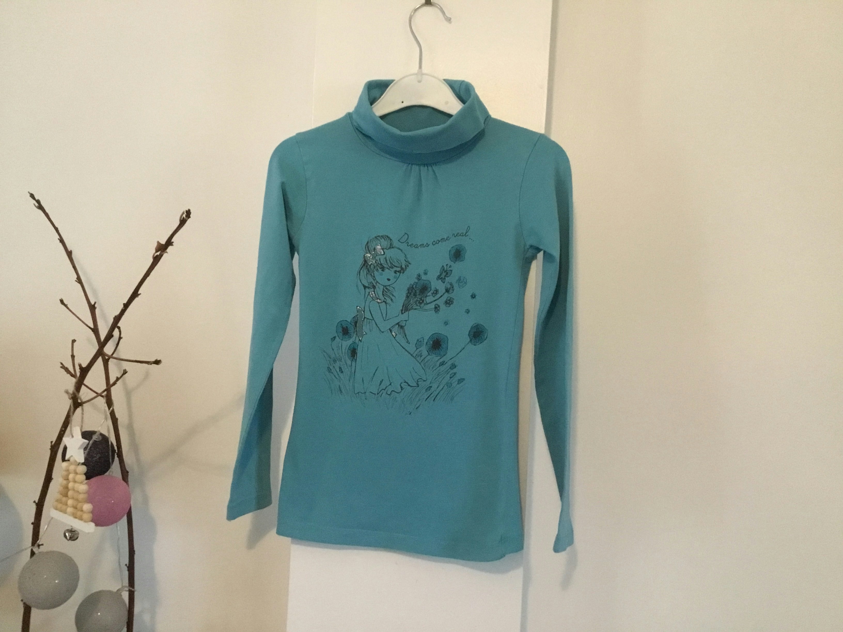 Col roulé bleu clair 10 ans in extenso